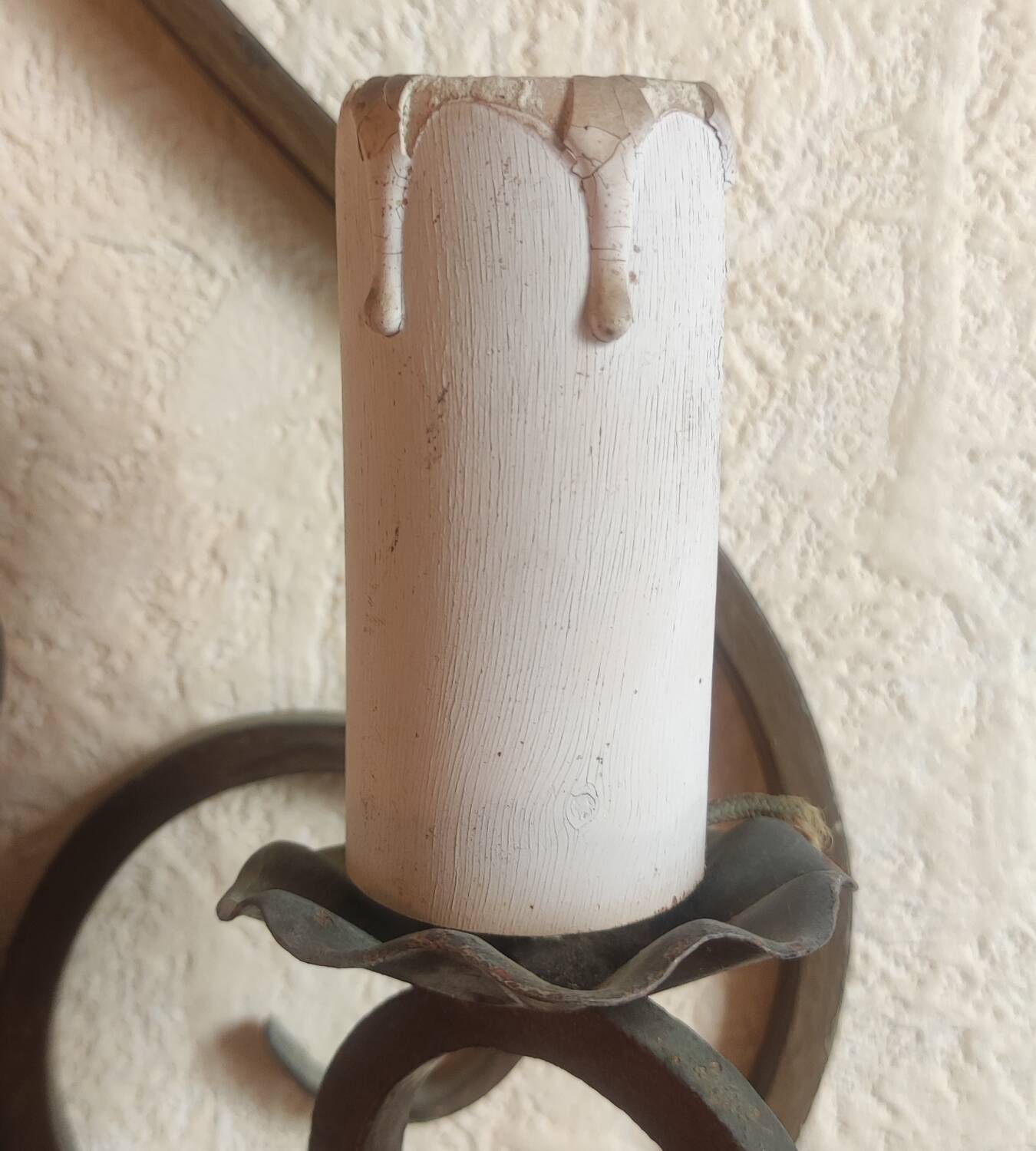 Old pair of wrought iron wall lights