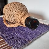 Old high wicker glass bottle