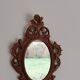 Classic red and gold patinated rocaille mirror, 35 cm x 23 cm