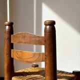 Low fireplace chair attributed to Charles Dudouyt.