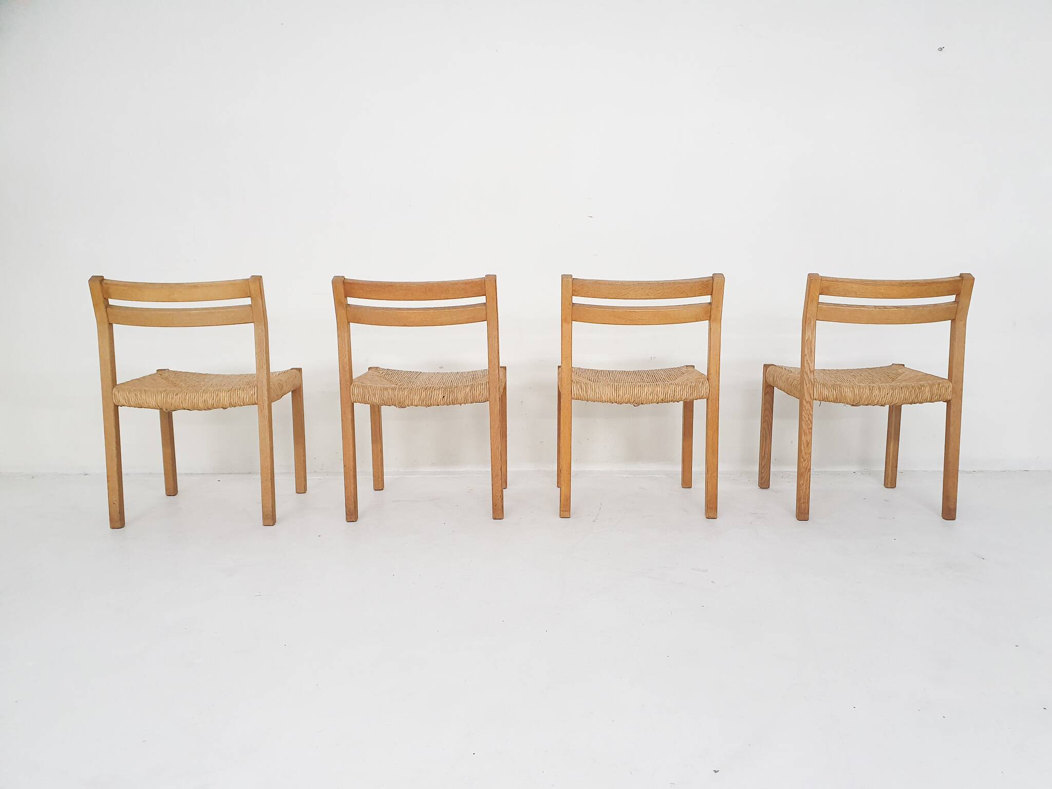 Set of four oak and sisal dining chairs model 401 by JL Moller, Denmark 1970's