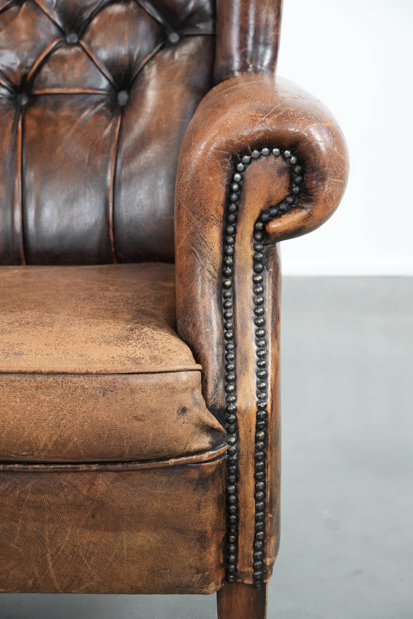 Unique large sheepskin Chesterfield wingback armchair in English style