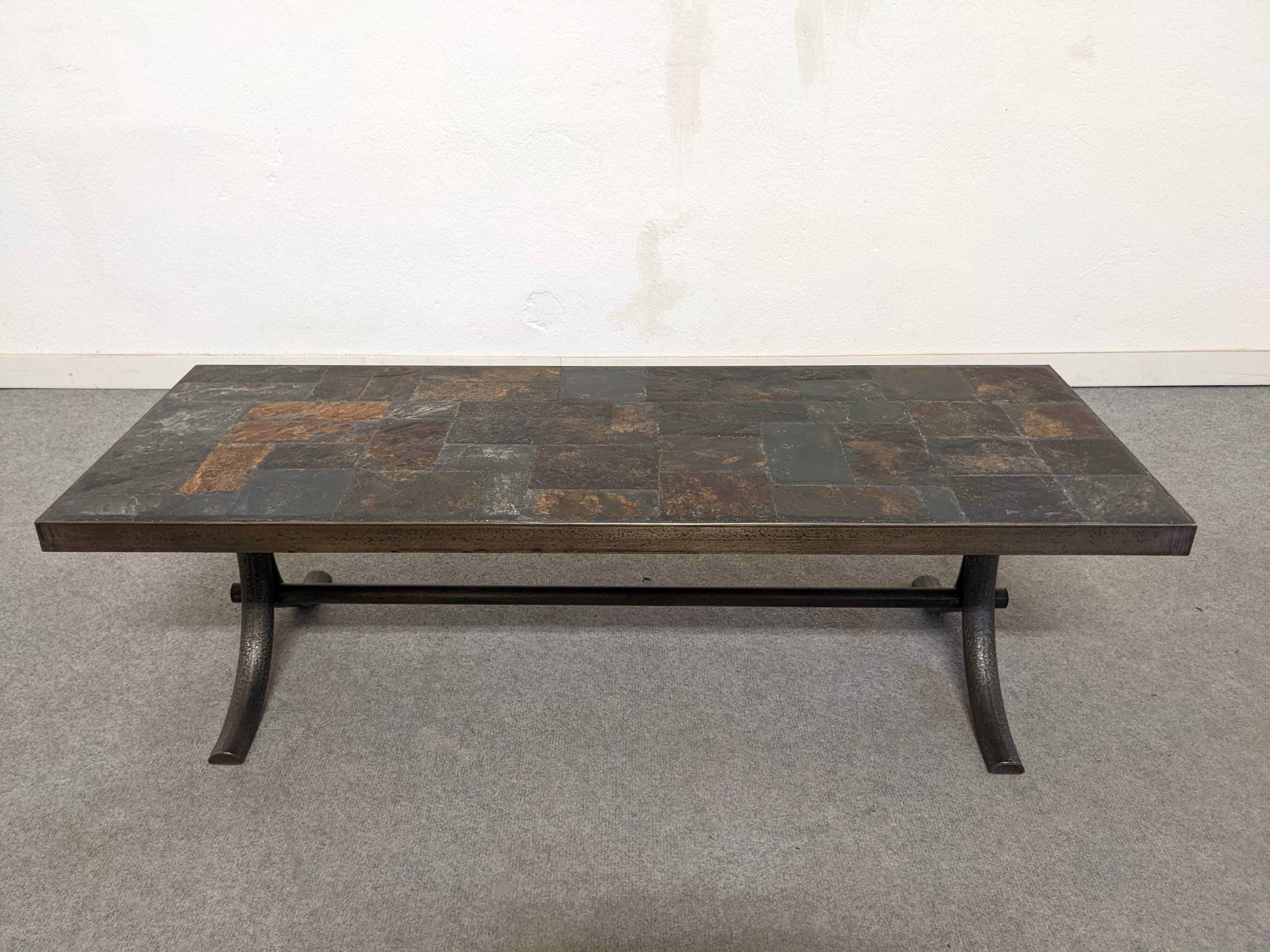 Brutalist coffee table in natural stone and wrought iron, France circa 1960.