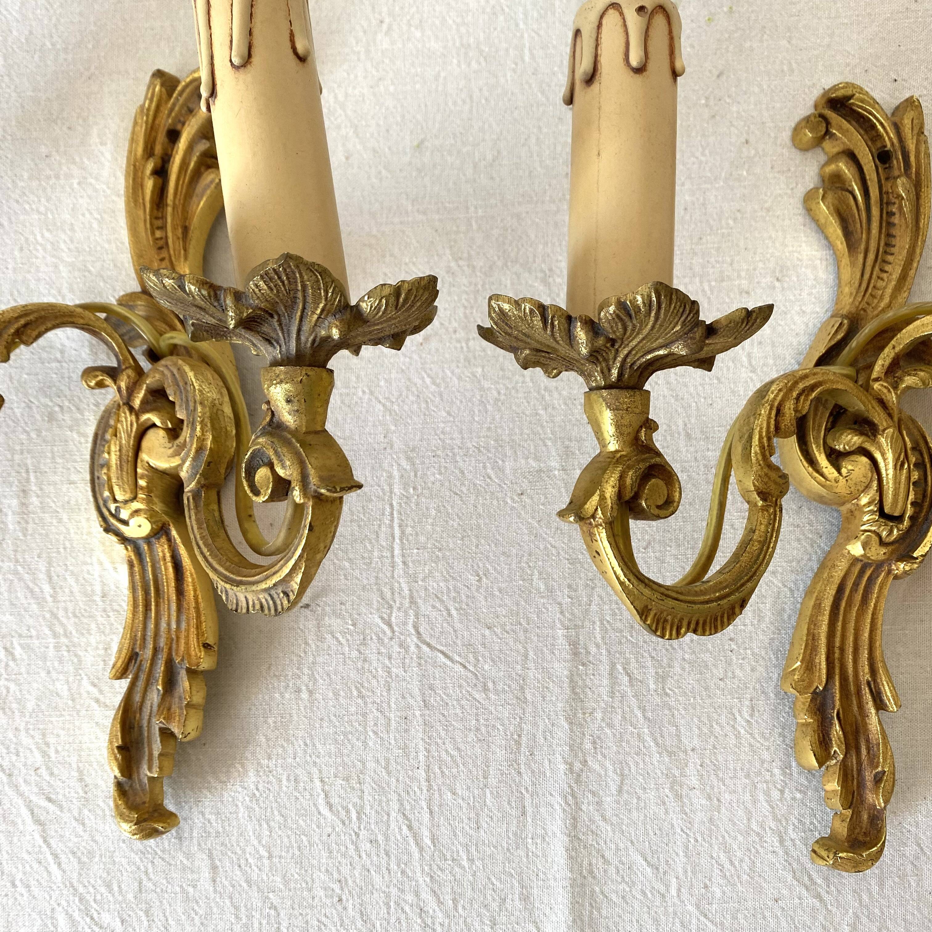 Pair of golden rococo-style wall lights