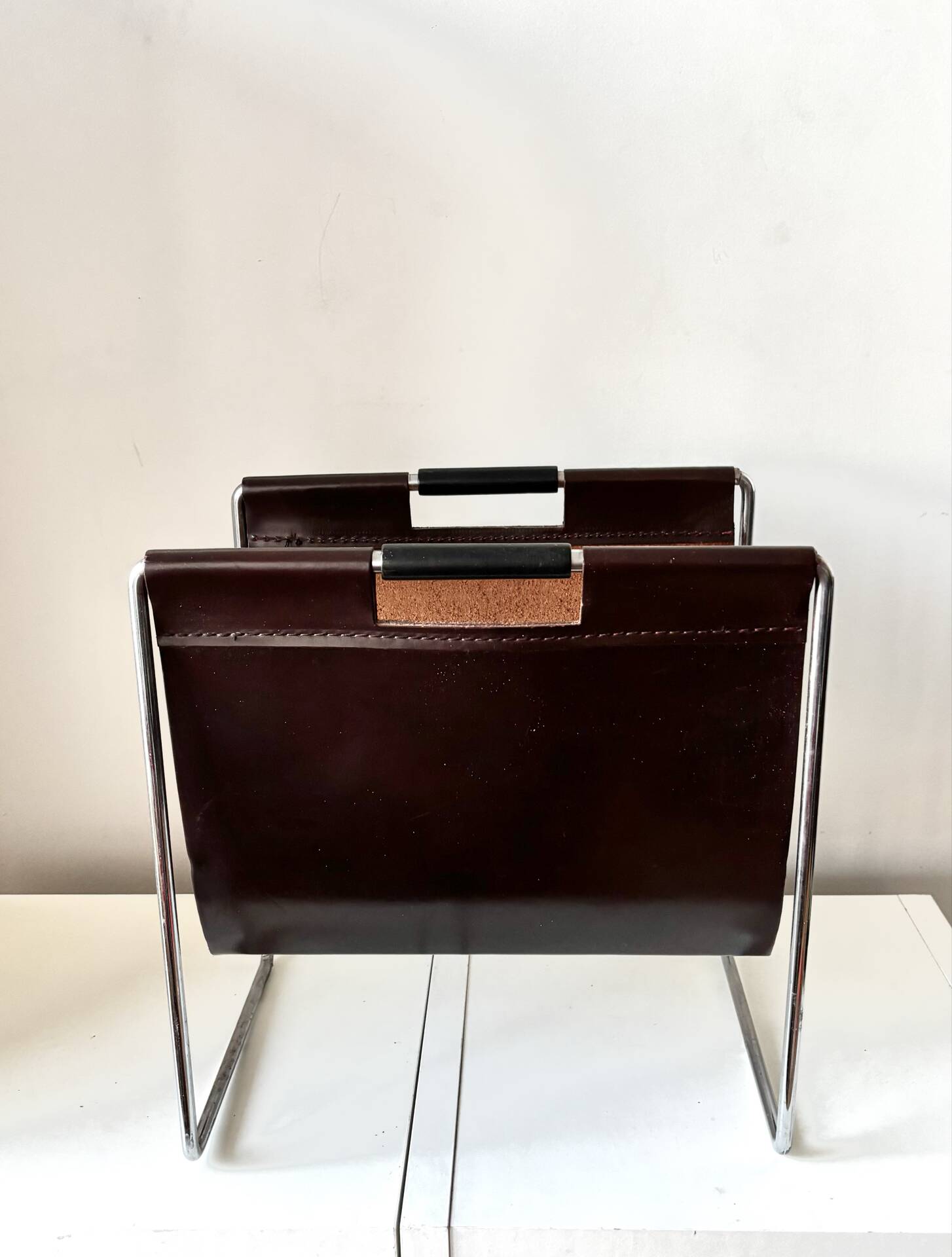 Leather and chrome magazine rack Brabantia