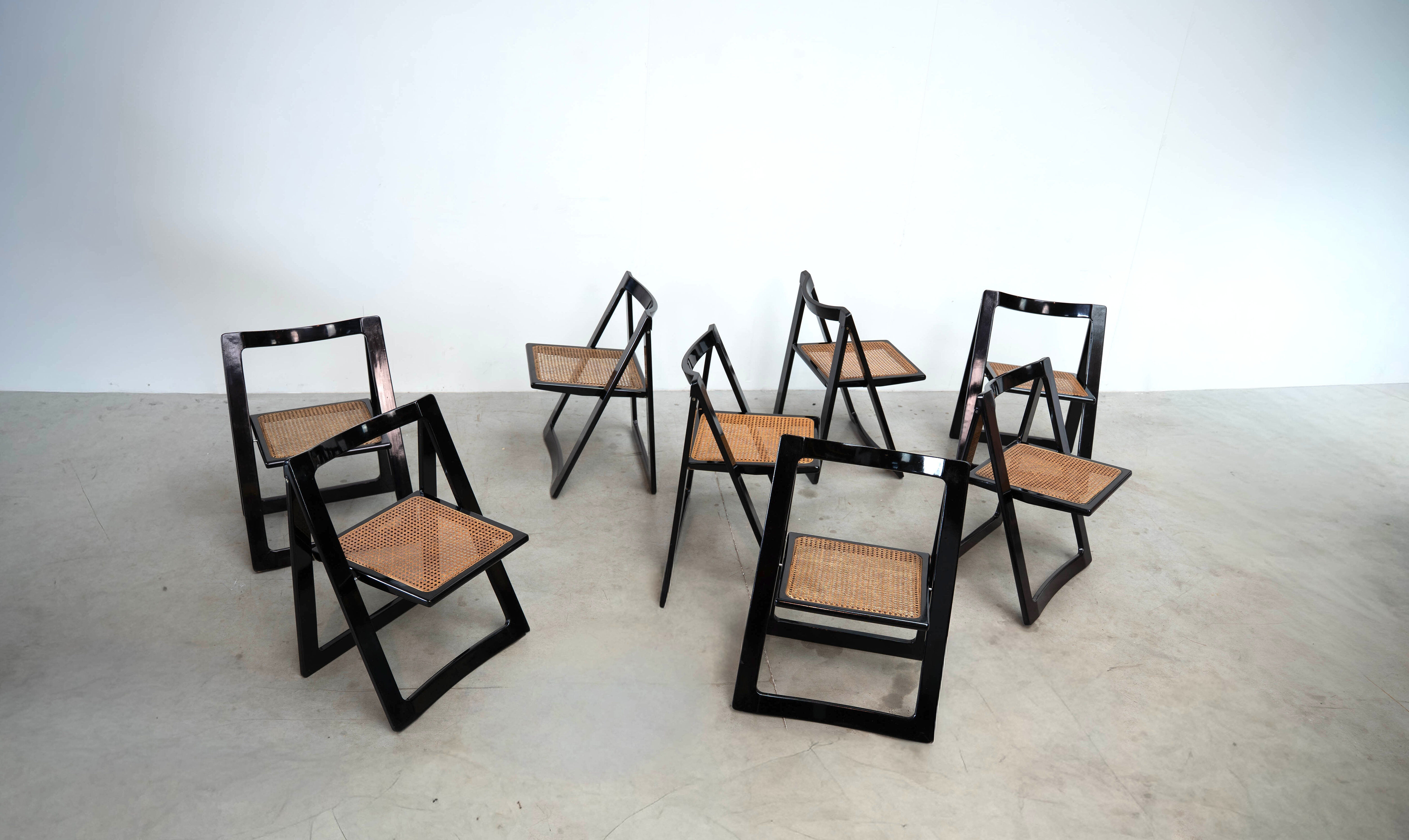 Set of eight folding dining chairs designed by Aldo Jacober for Alberto Bazzani