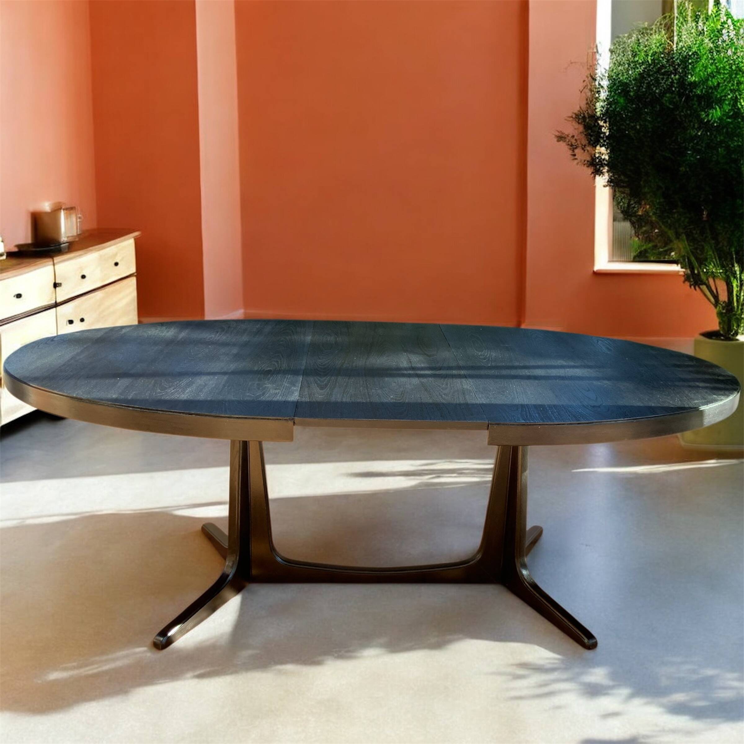 Oval extendable dining table in the style of baumann — ebonised black — vi