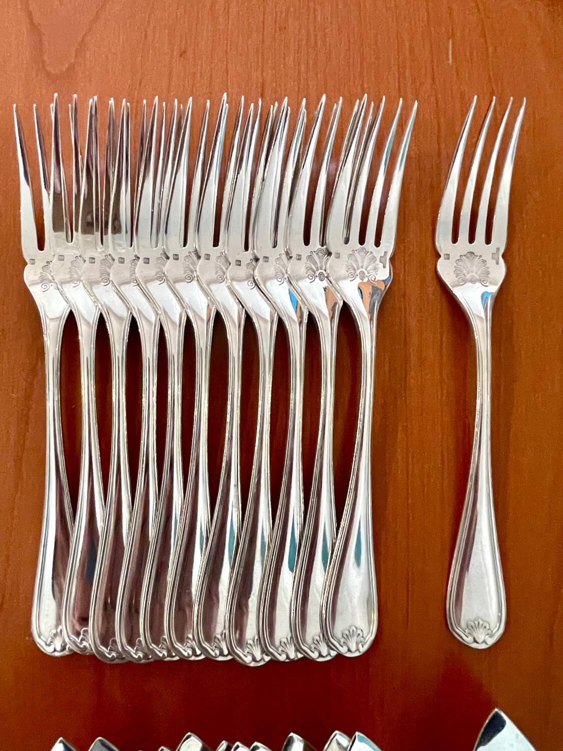 Christofle Marot Berain, 12 fish cutlery sets, shell decor