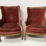 Two Louis XVI style wing chairs in gilded wood, 20th century