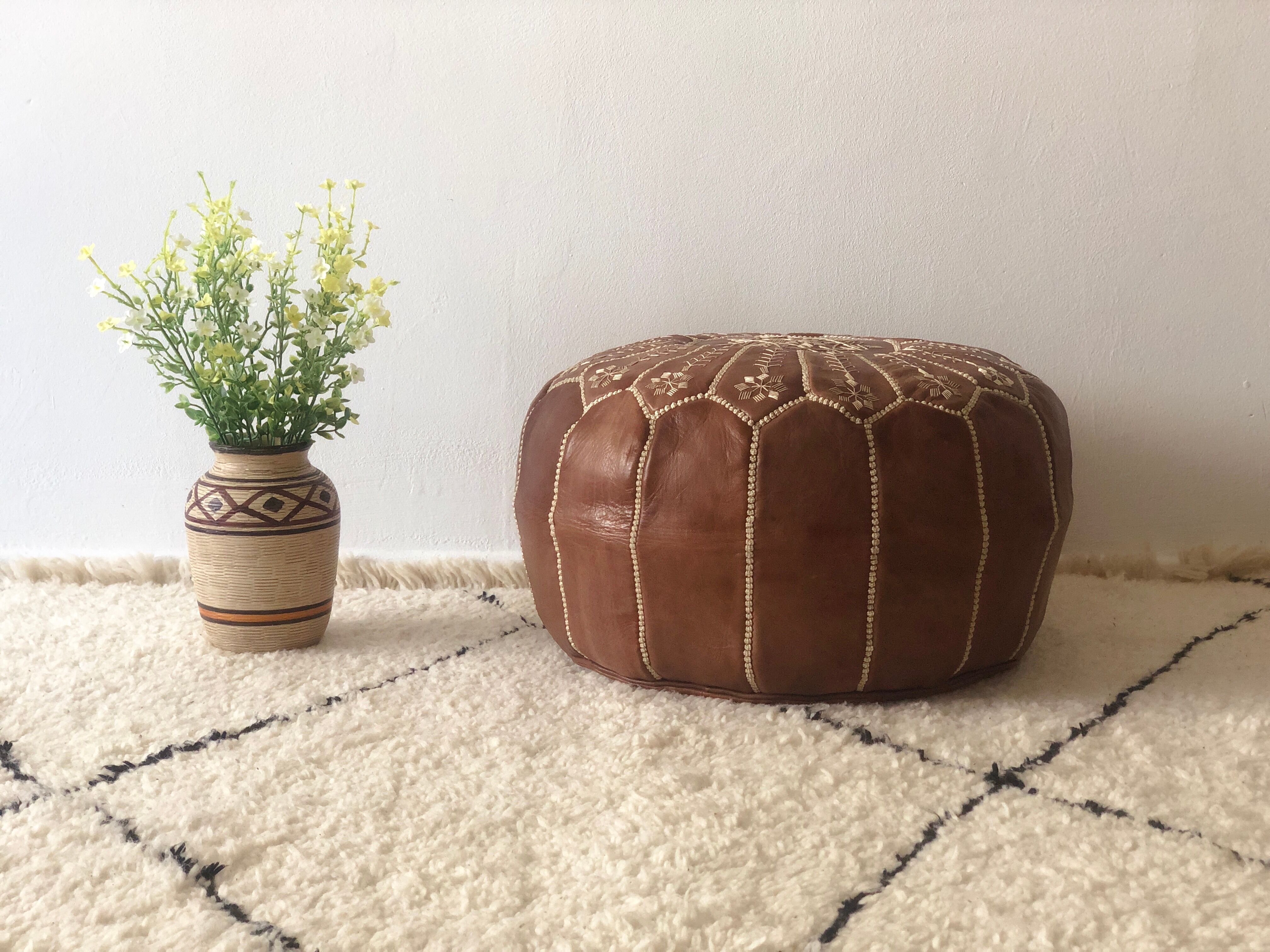 Moroccan-style brown leather pouf