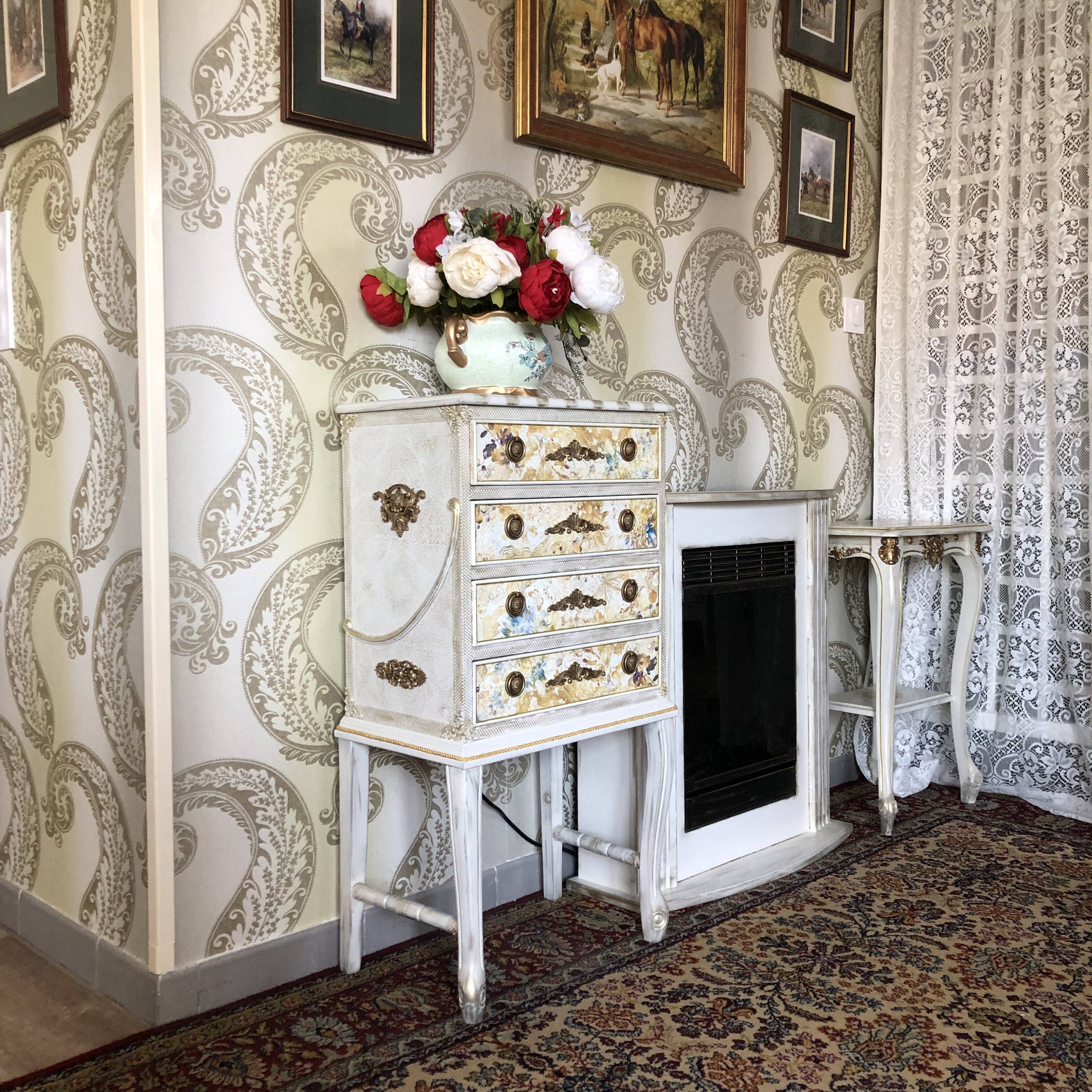Vintage commode refurbished with 4 drawers in classic style with floral decor.
