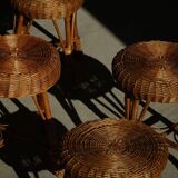 A set of 4 vintage Scandinavian rattan stools, in the style of Tony Paul, from the 1960s.