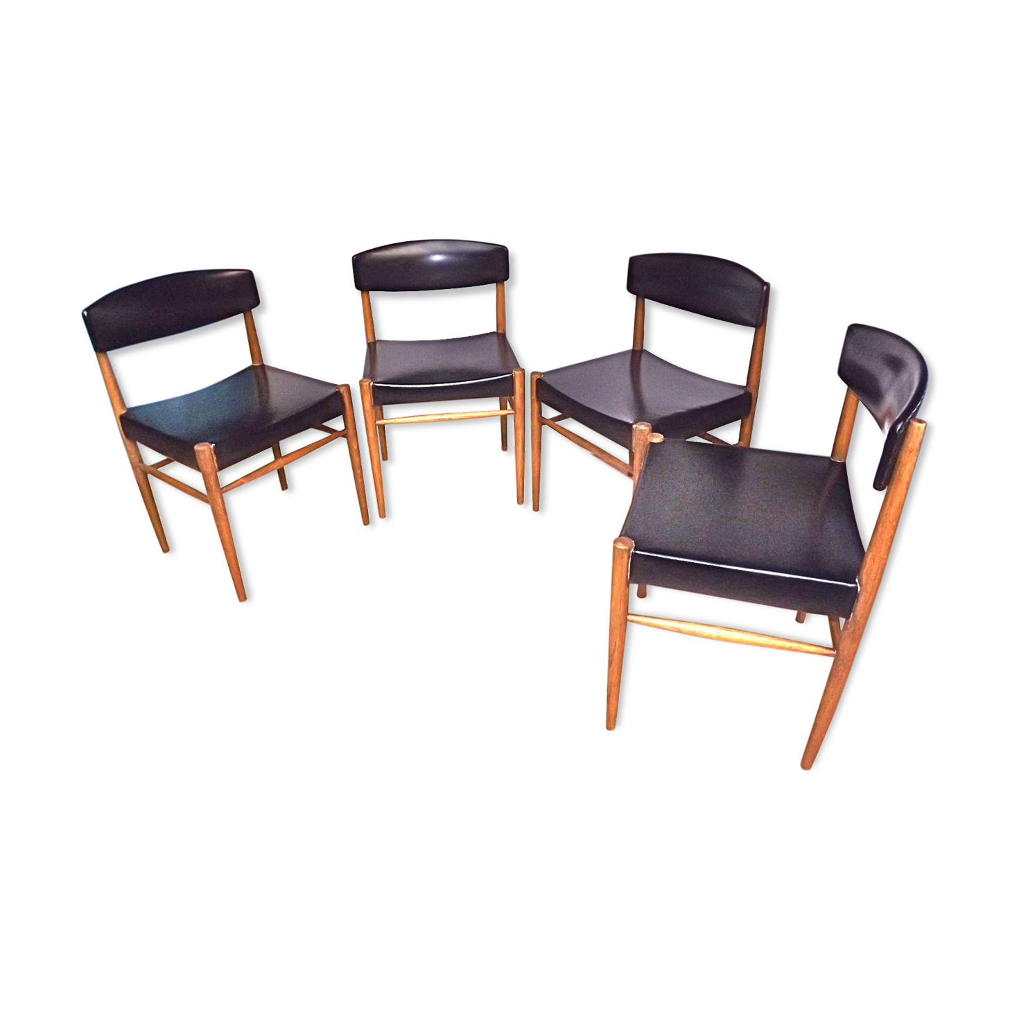 Four Scandinavian-style chairs