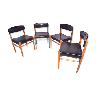 Four Scandinavian-style chairs
