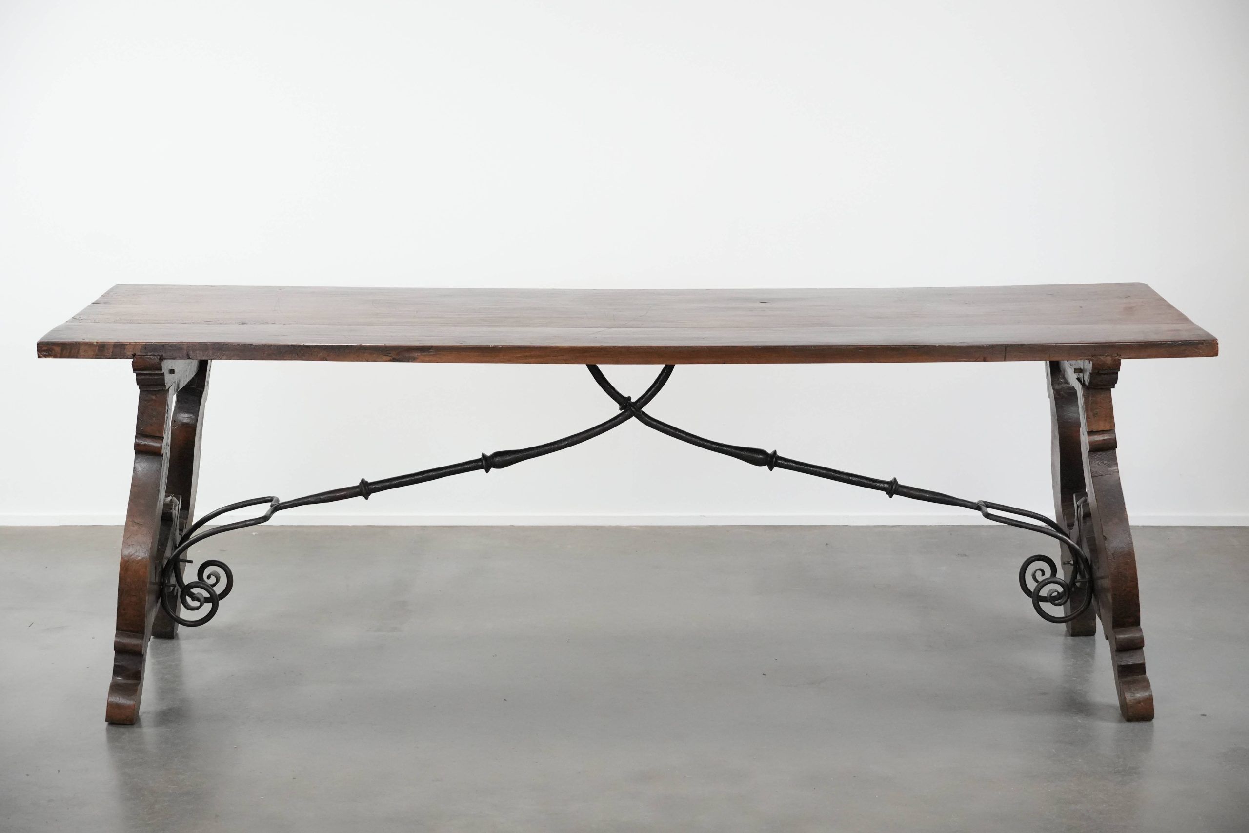 Antique 18th-century Spanish dining table with a wrought iron base