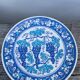 Blue decorative plate with grapes