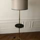 Tripod floor lamp with adjustable height and shelf from the 1960s.
