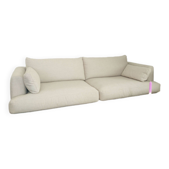 Beige three-seater sofa