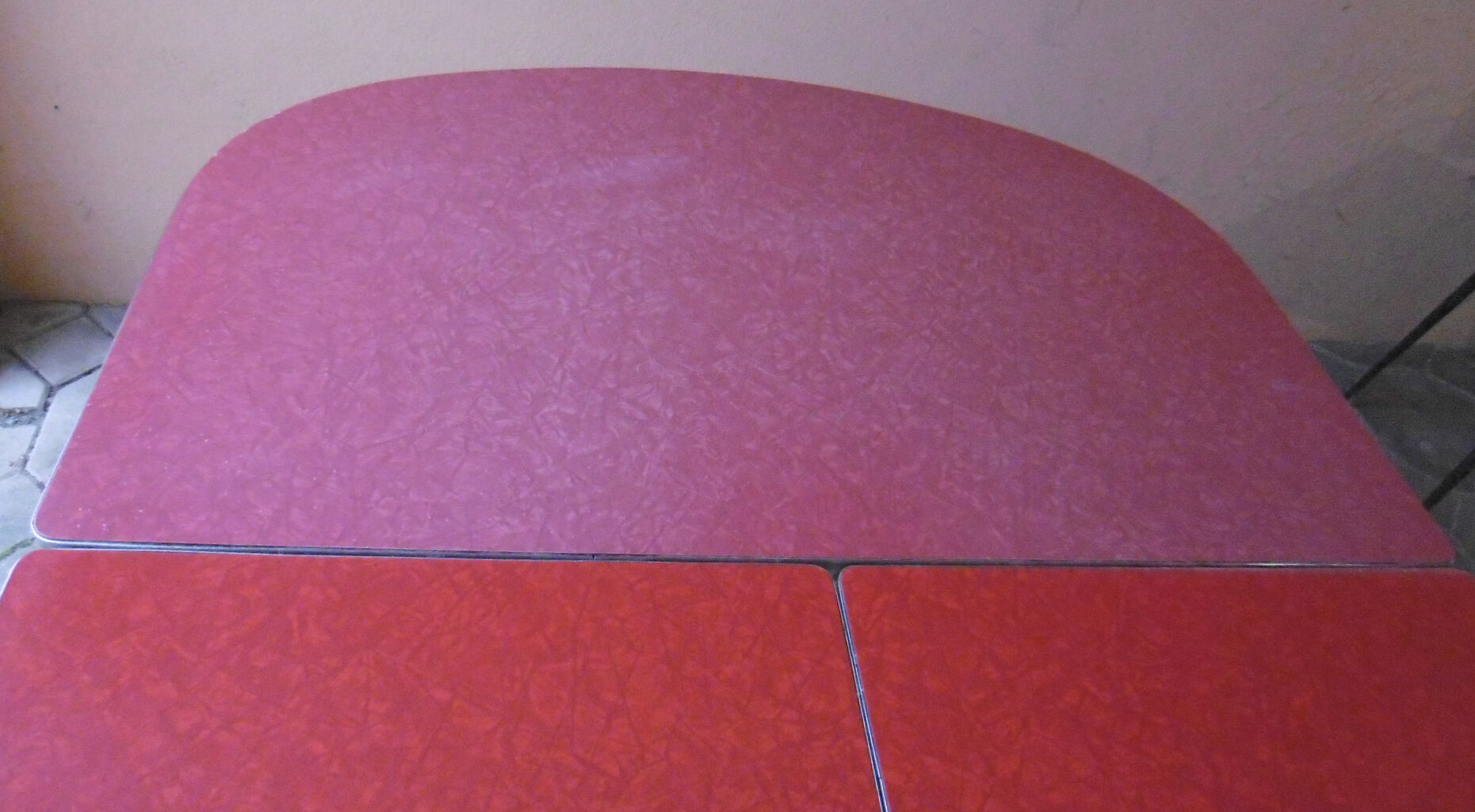 Vintage table of the 60s in red formica and chrome legs