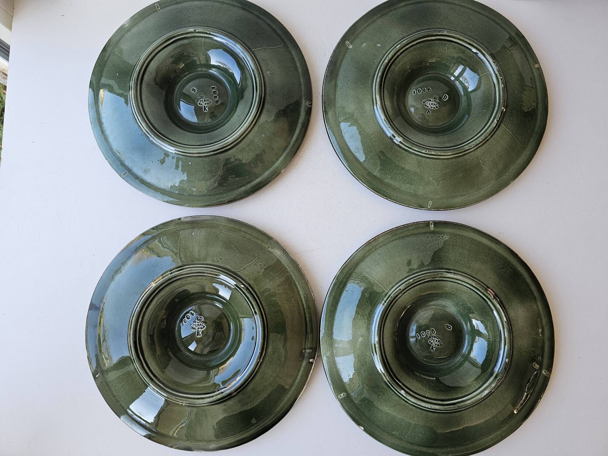 Set of 4 vintage green and white majolica oyster plates.