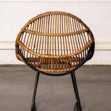 Rattan armchair with metal legs