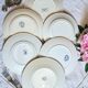 Old mismatched flat plates made of ironstone earthenware.
