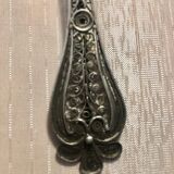 silver sprinkler spoon