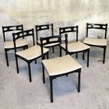 Set of six black lacquered wooden chairs.