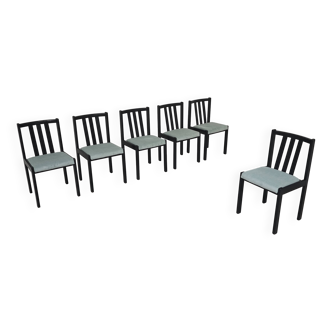 Set of 6 modernist black chairs with light blue-green ribbed fabric.