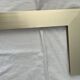 Brushed gold aluminium shelf and smoked glass from the 1970s.