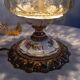 Baroque inspired table lamp, bronze, ceramic flowers and glass globe