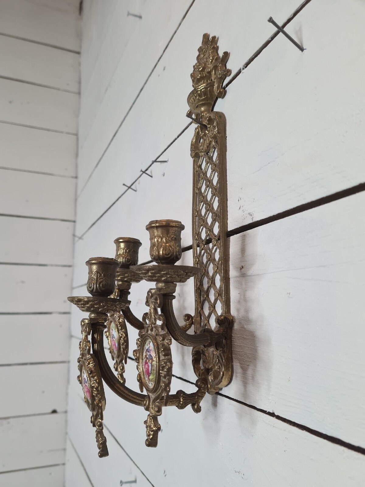 Bronze wall candle holder