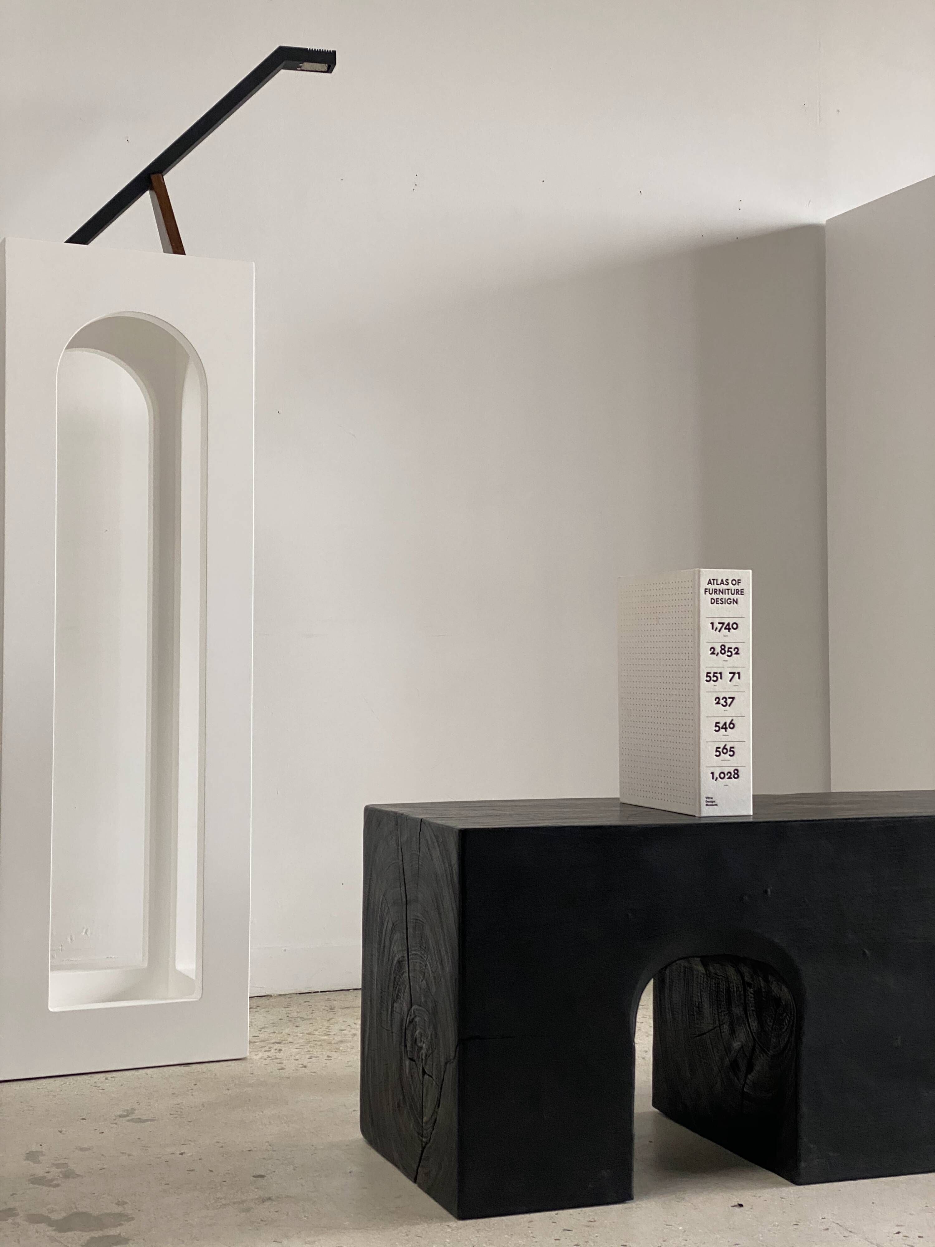 Bench in solid monoxyl wood, carved base in 3 arches - Black color
