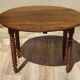 Walnut drop-leaf table with honey spoon legs.