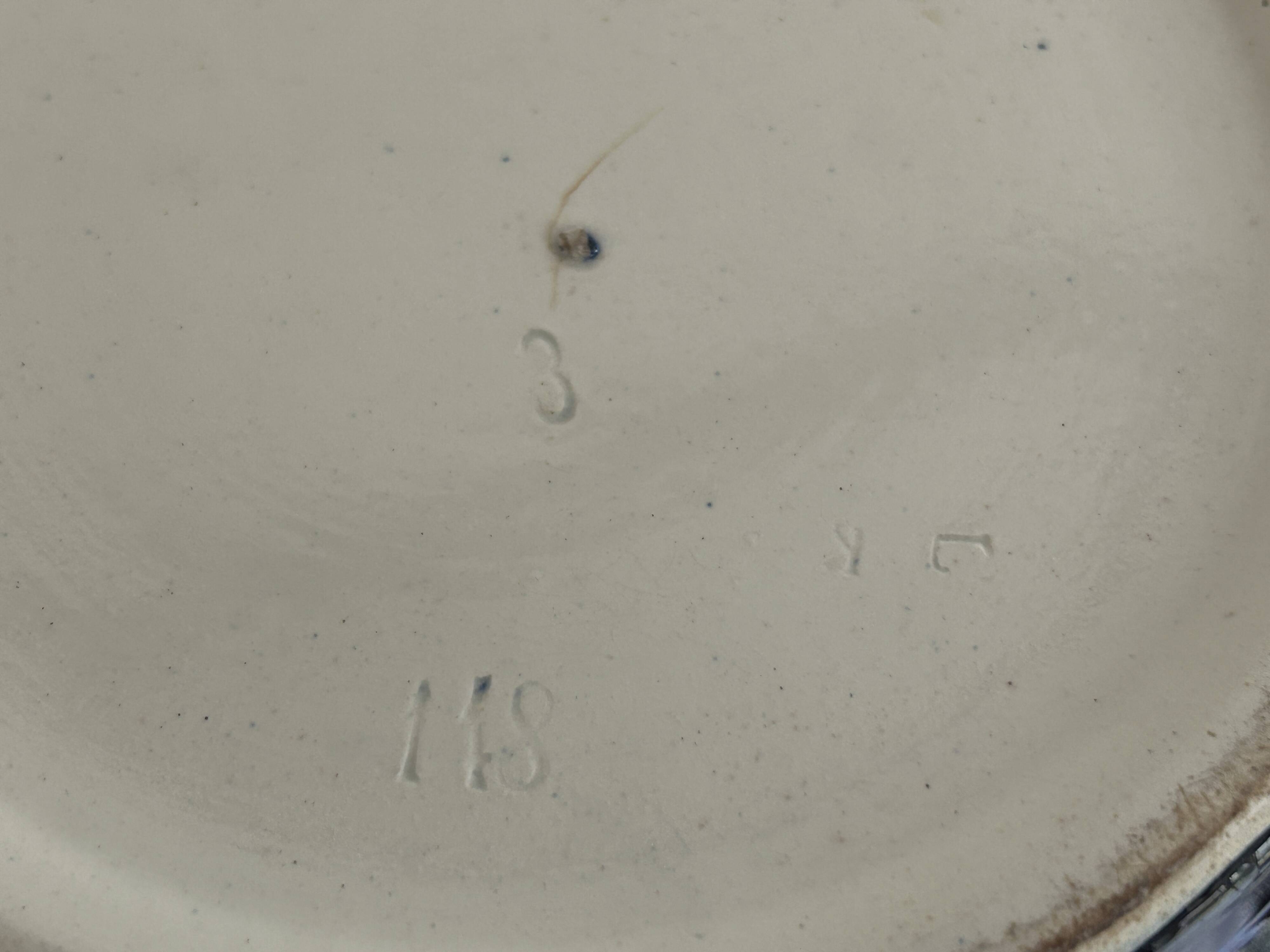 Ceramic cache-pot with bronze frame