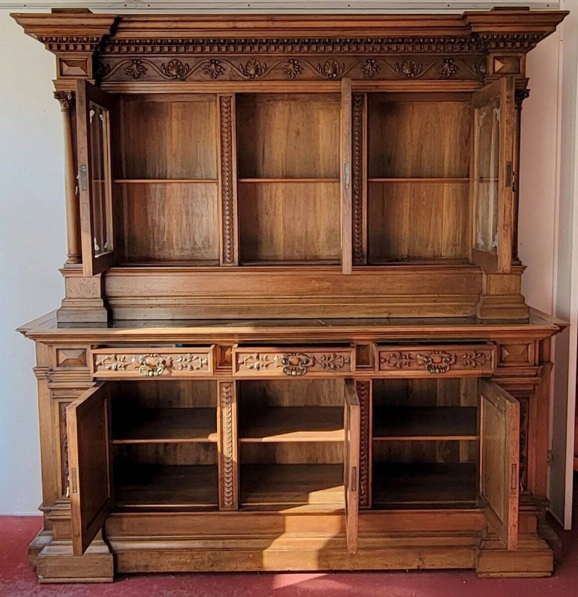 Two-body buffet, made of richly carved solid walnut.
