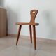Low brutalist tripod chair in solid oak from the 1960s.
