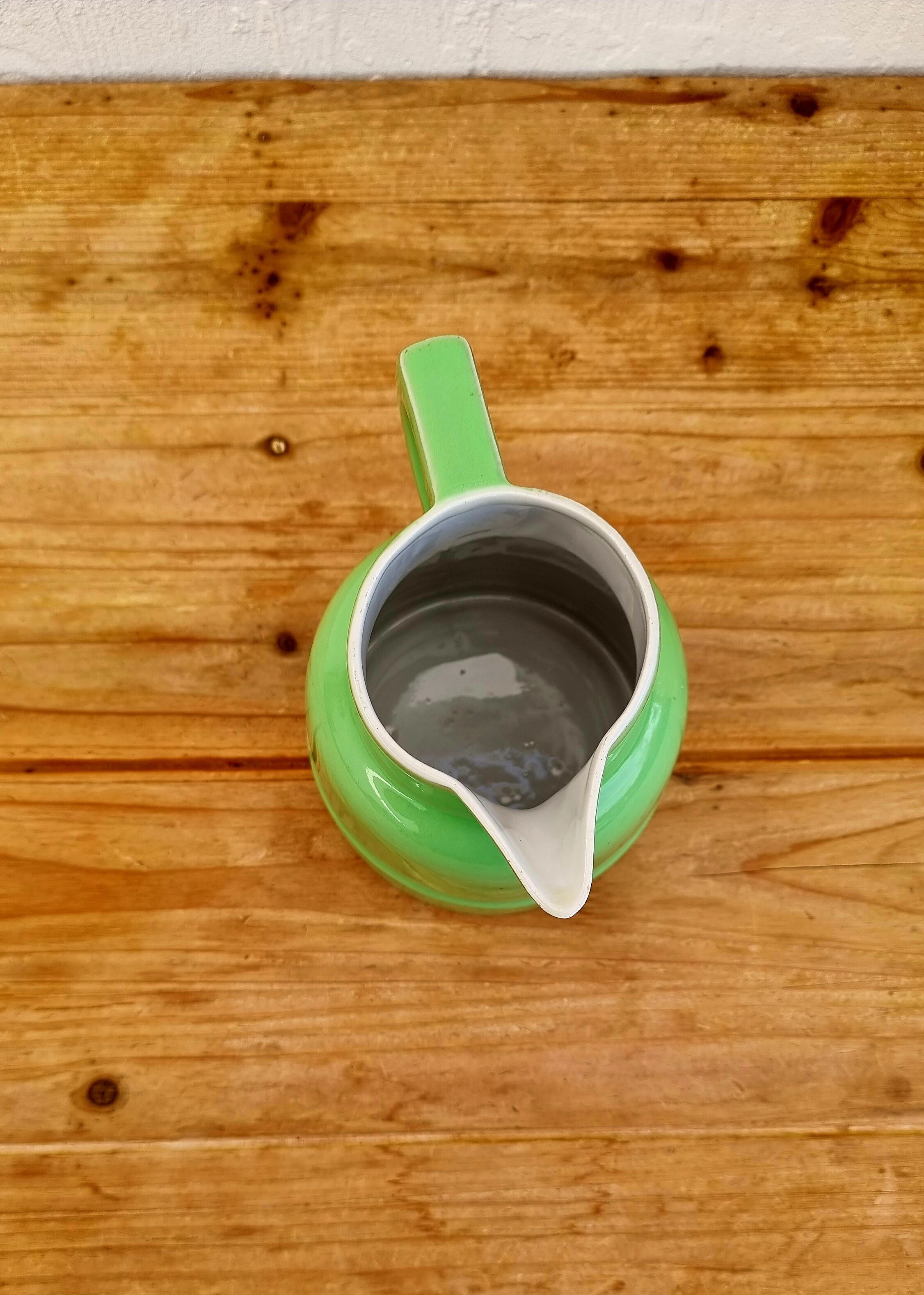 Vintage green earthenware pitcher