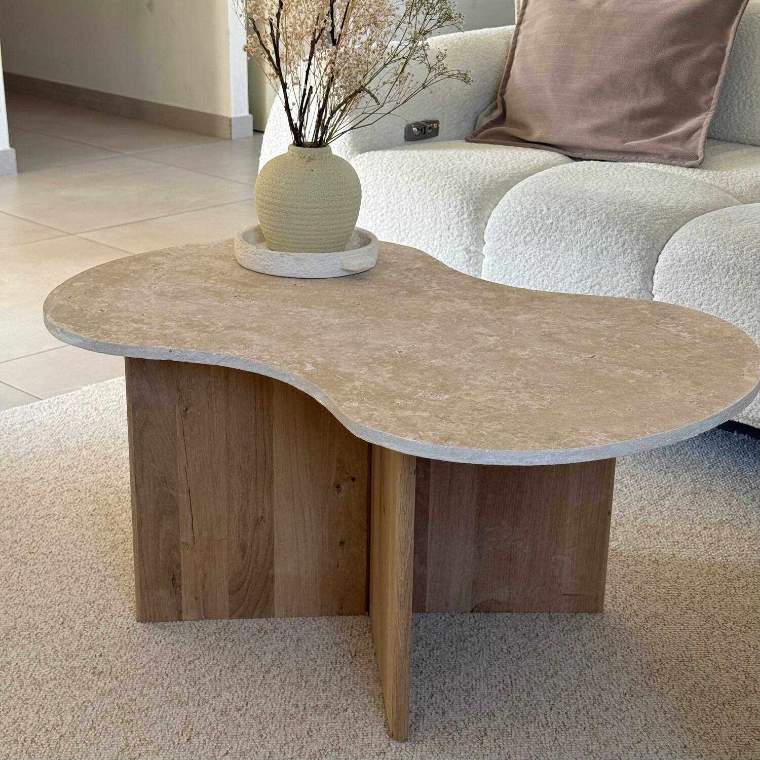 Cloud coffee table in travertine and dark oak.