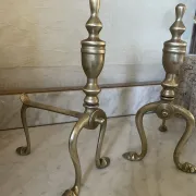 Pair of Victorian brass fire dogs from the late 19th century.