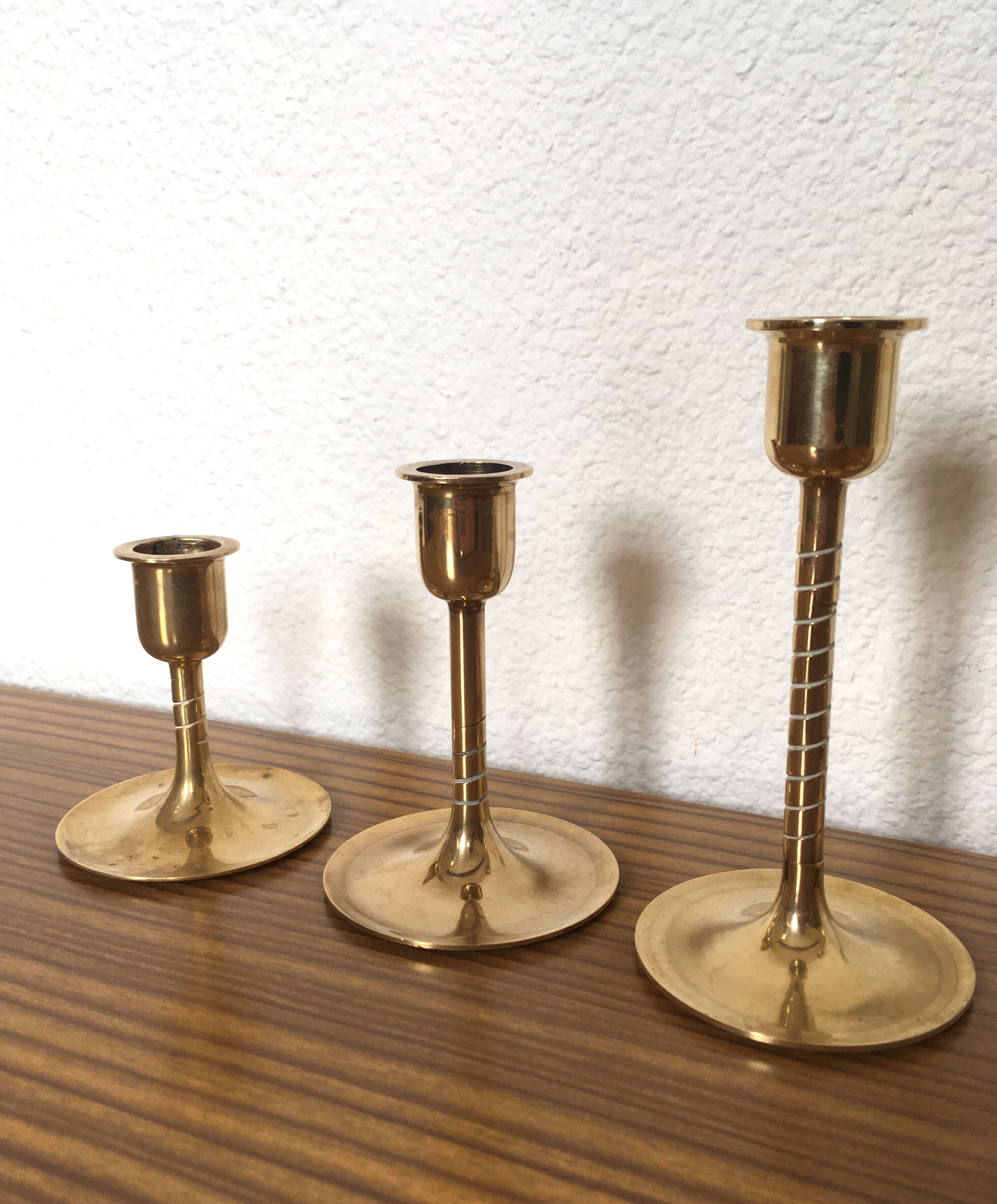 Series of 7 Scandinavian brass candlesticks