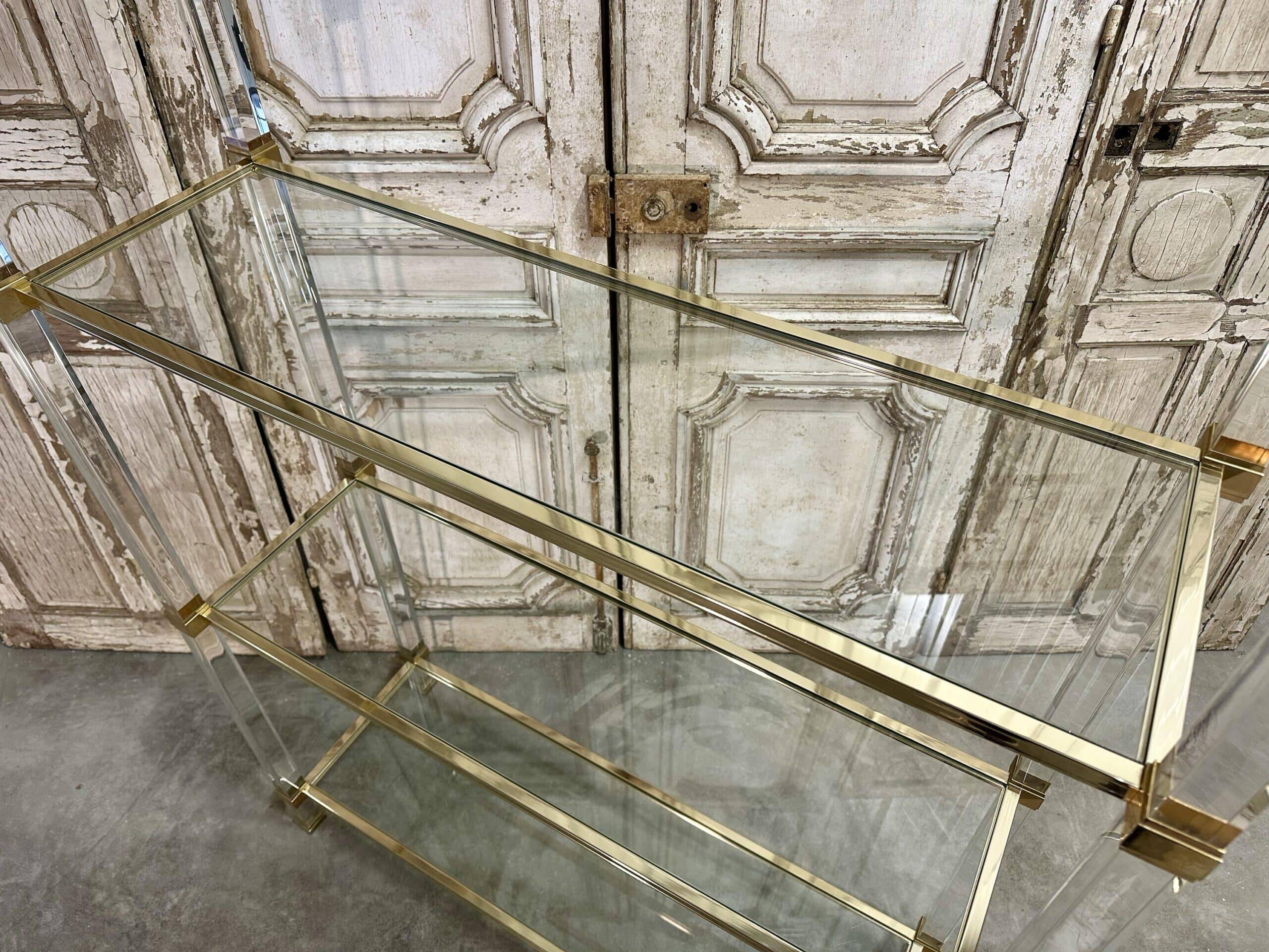 Plexiglass shelf by Pierre Vandel in Hollywood Regency style circa 1970.