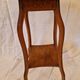 Antique Art Nouveau pedestal table with carved wood and marble top.