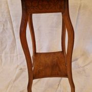 Antique Art Nouveau pedestal table with carved wood and marble top.