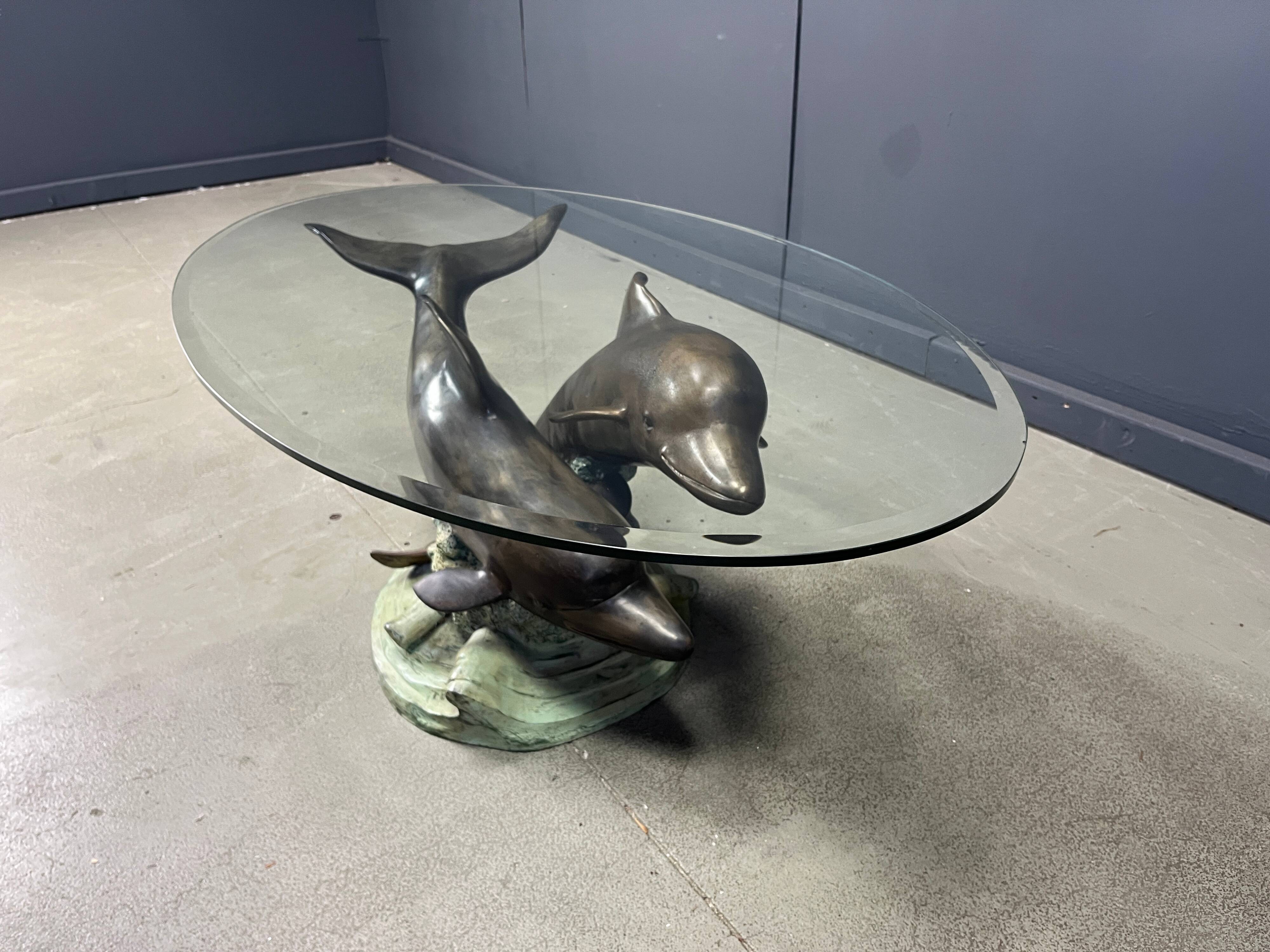 Bronze dolphin coffee table signed C Caudion, 1960s