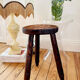 Dark wood tripod stool