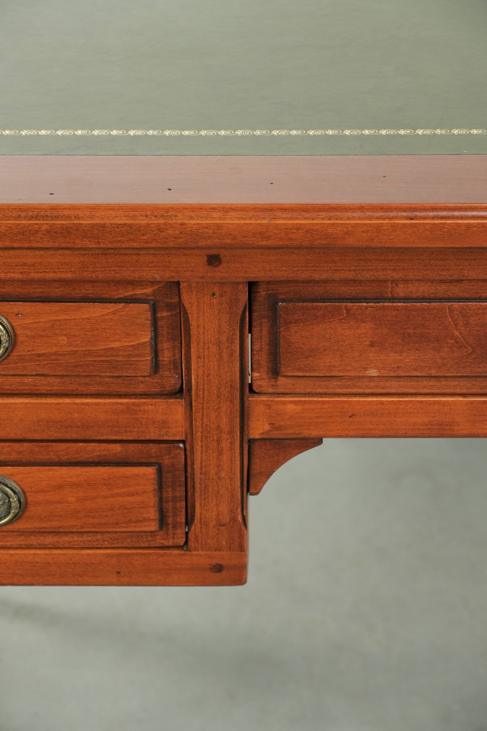 Elegant English style desk with green leather top, gold details and drawers