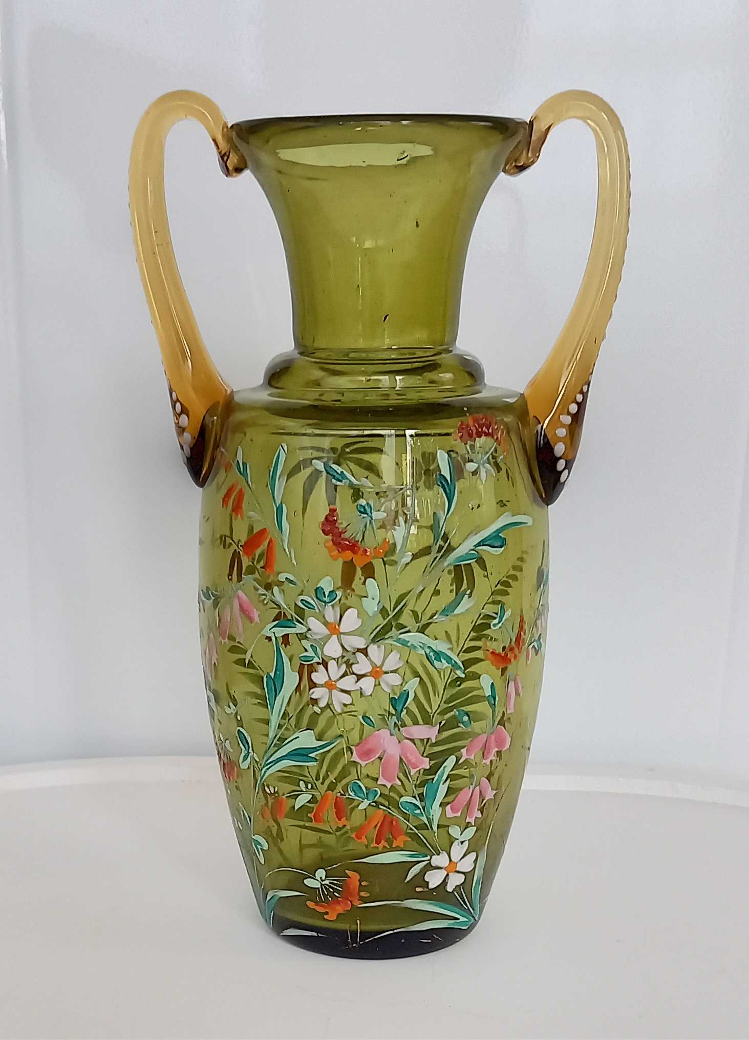 Enamelled green glass vase