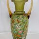 Enamelled green glass vase