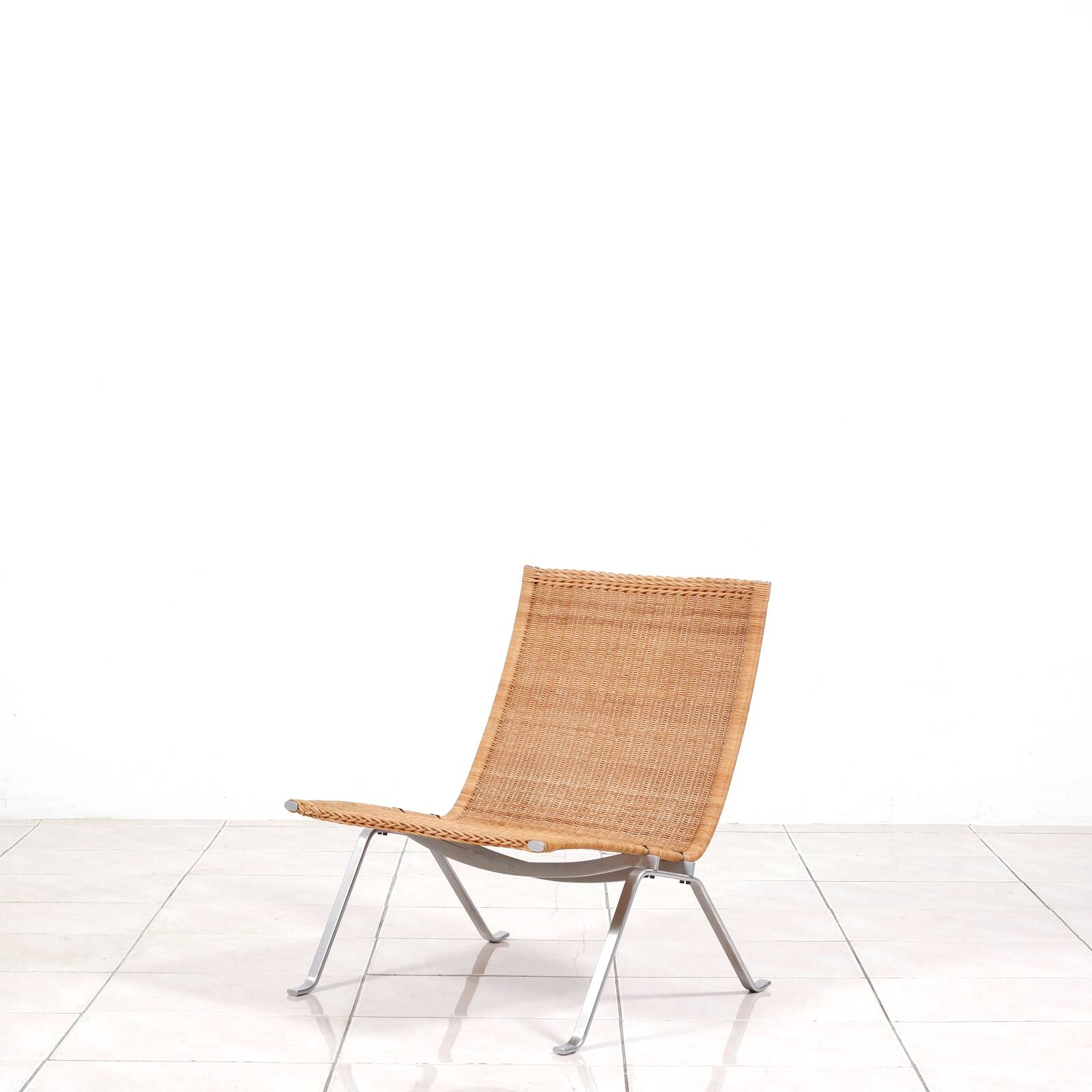PK 22“ lounge chair in rattan by Poul Kjaerholm for E. Kold Christensen